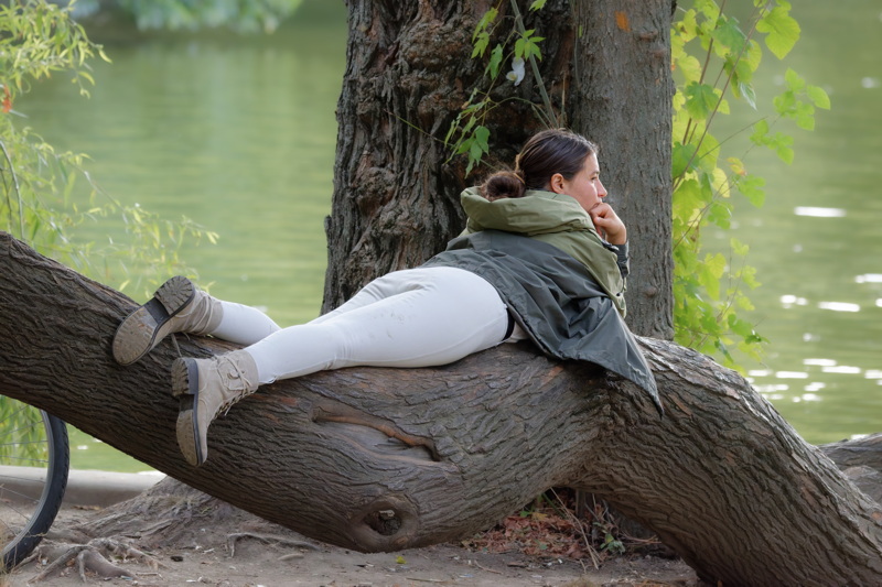 Girl on a tree trunk
